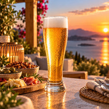 Lade das Bild in den Galerie-Viewer, OONYQ Crystal Beer 600 ml – bruchsicheres Bierglas aus Tritan mit Bier auf der Terrasse mit Meerblick