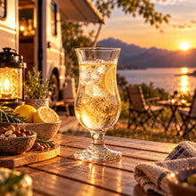 Lade das Bild in den Galerie-Viewer, OONYQ Crystal Hurricane 335 ml – bruchsicheres Cocktailglas aus Tritan mit Cocktail vor dem Wohnmobil bei Sonnenuntergang